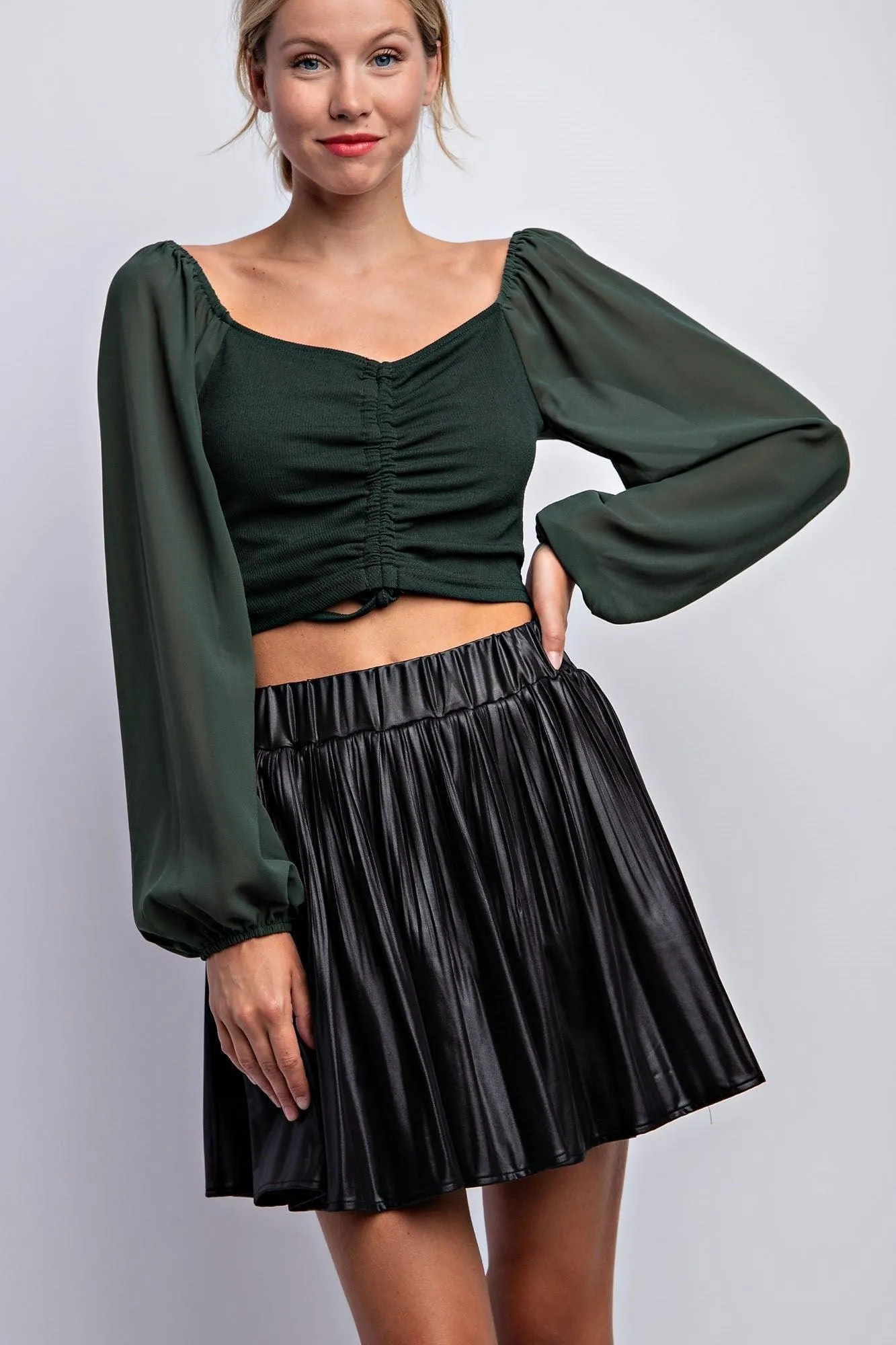 pleated faux leather mini skirt